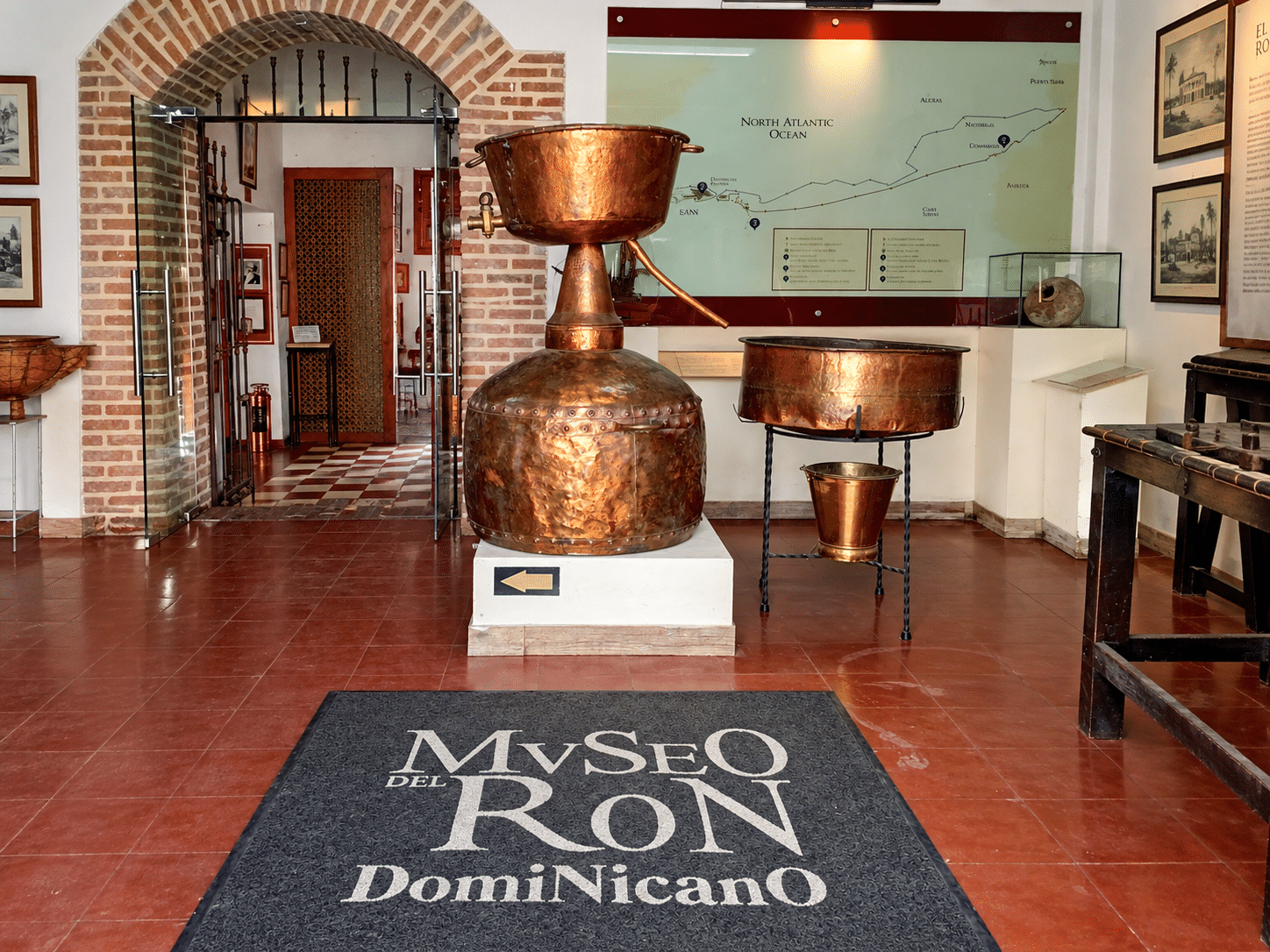Rum Museum in Santo Domingo main hall with historical rum production equipment, visited by student educational and leisure groups in the Dominican Republic.